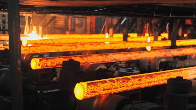 Con cast round steel billets on a runout table.