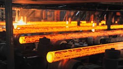 Con cast round steel billets on a runout table. Con cast round steel billets on a runout table.