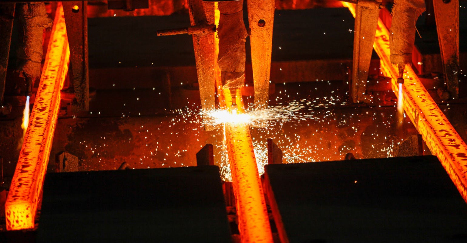 Steel billets at torch cutting of concaster run-out.