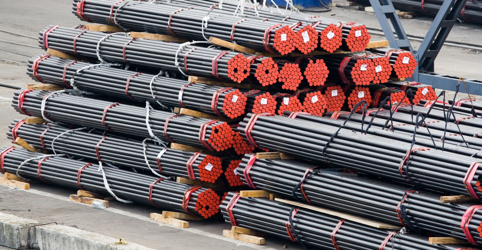 Steel bars, stacked and prepared for loading.