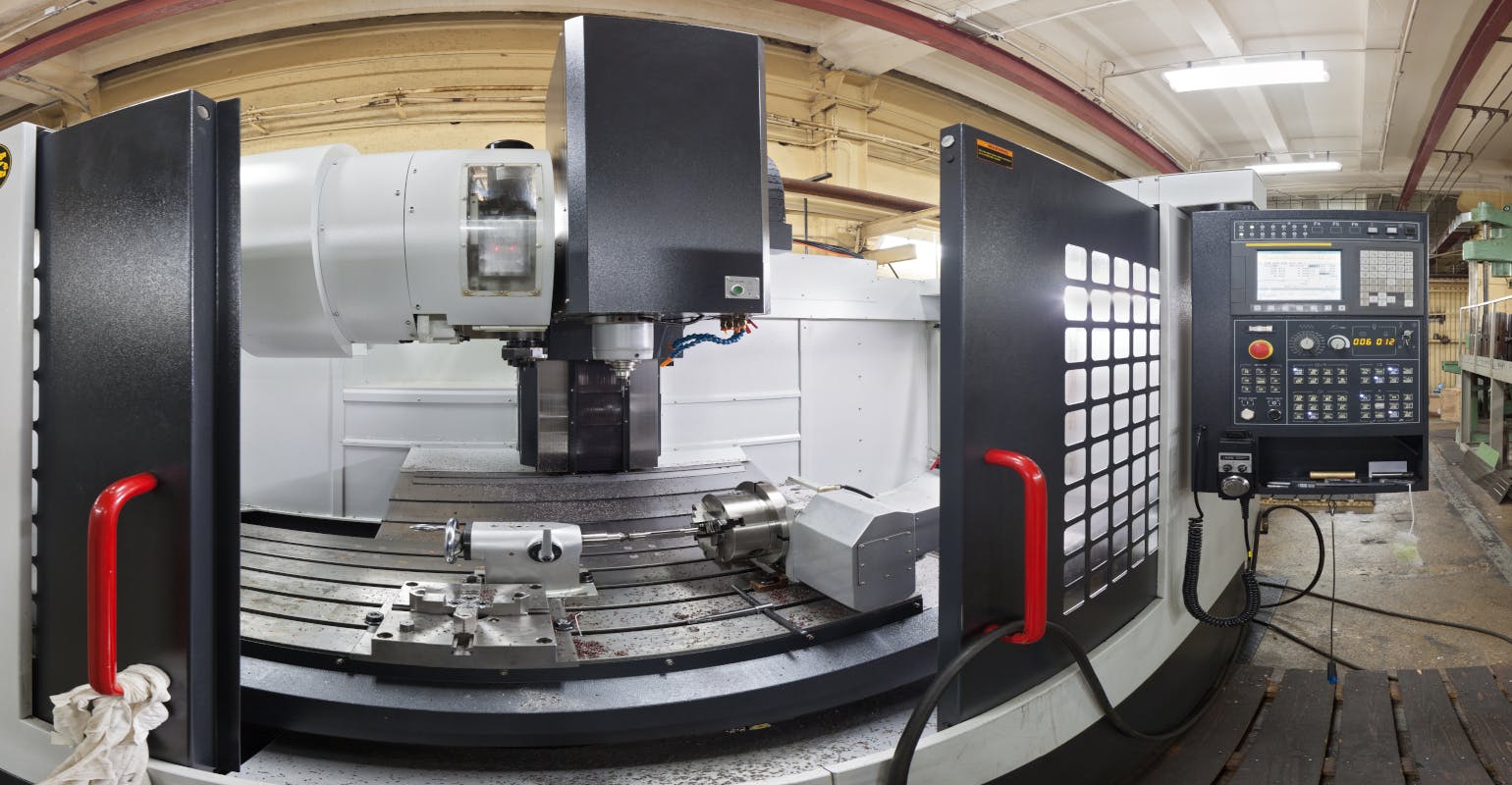 Fish-eye view of an open horizontal machine center.