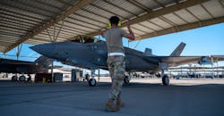 USAF Aircraft Maintenance Unit crew chief, directs an F-35A Lightning II for takeoff. USAF Aircraft Maintenance Unit crew chief, directs an F-35A Lightning II for takeoff.
