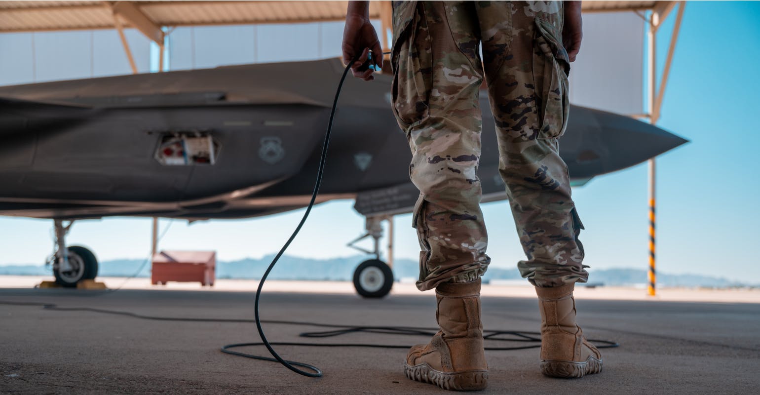 USAF Airman 1st Class Jacob Caldwell, 61st Aircraft Maintenance Unit crew chief, connects the communication systems on an F-35A Lightning II aircraft Sept. 27, 2022, Luke Air Force Base, Arizona.