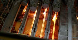 Steel continuous casting in operation. Steel continuous casting in operation.