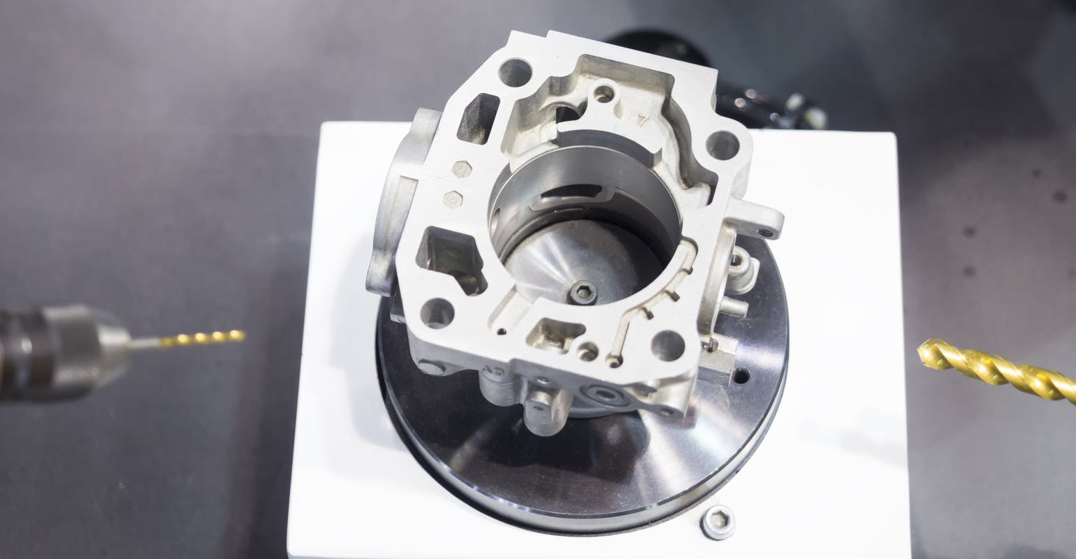 CNC machining center cutting mold tooling using endmills.