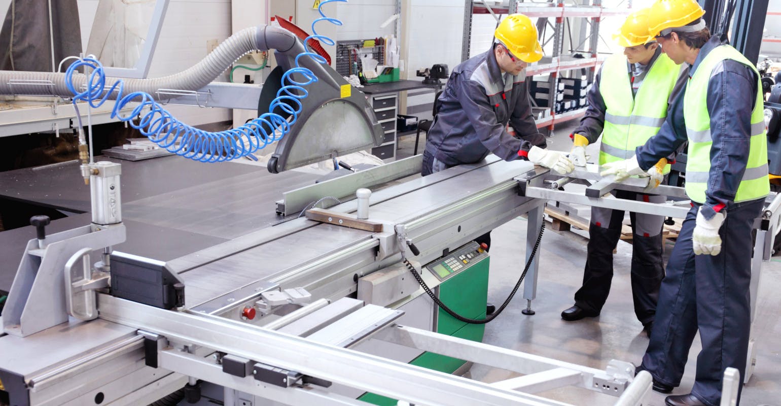 CNC machine shop with lathes, technicians and workers.