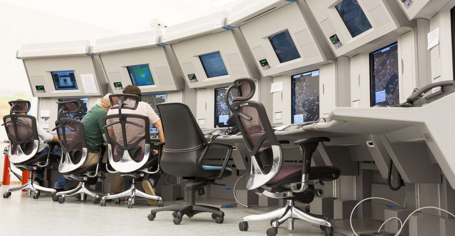 Air traffic controllers and monitors.