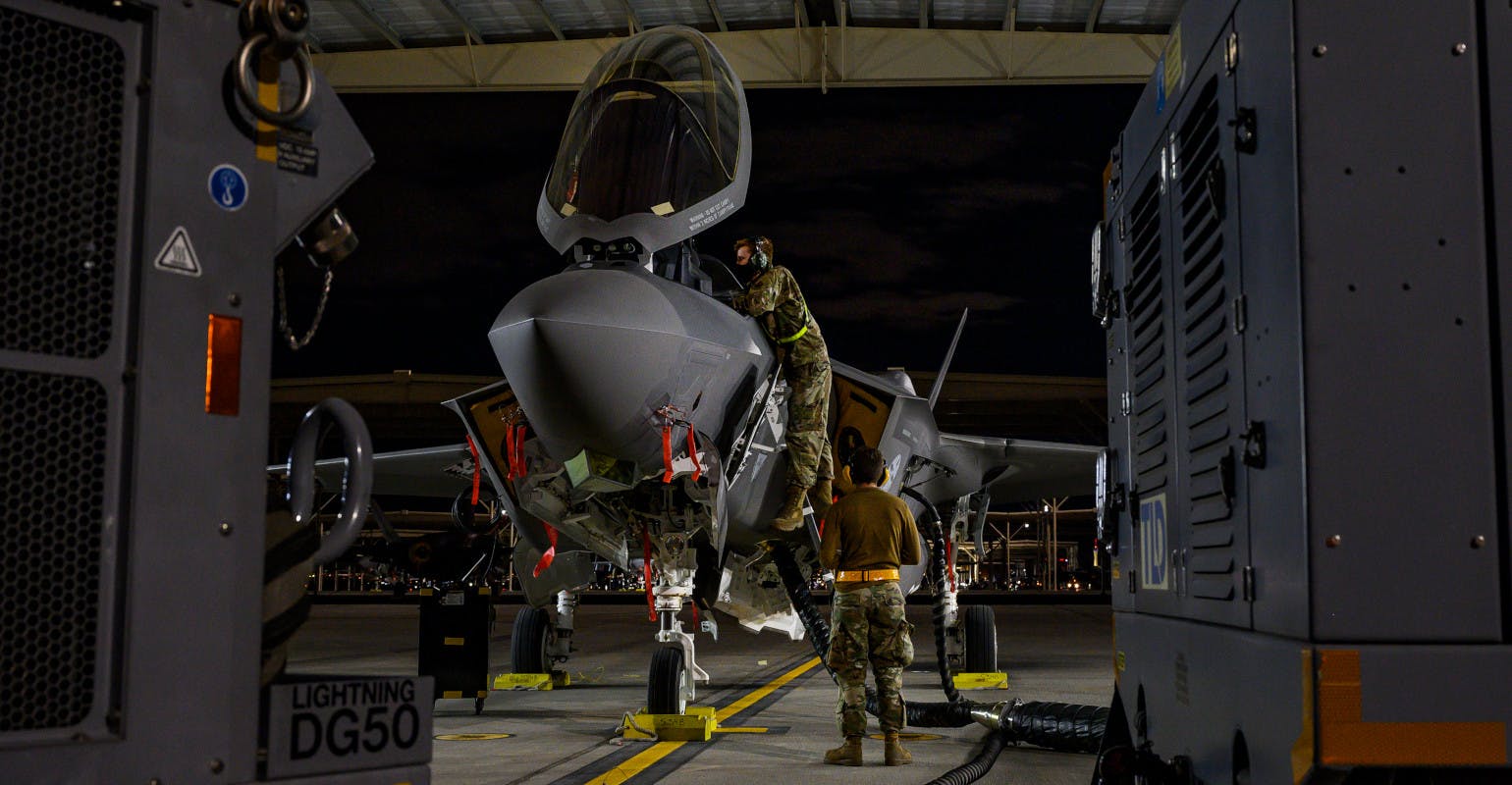 Aircraft maintenance airmen assigned to the 57th Aircraft Maintenance Squadron Bolt Aircraft Maintenance Unit, perform preventive maintenance for an F-35 Lightning II fighter jet.