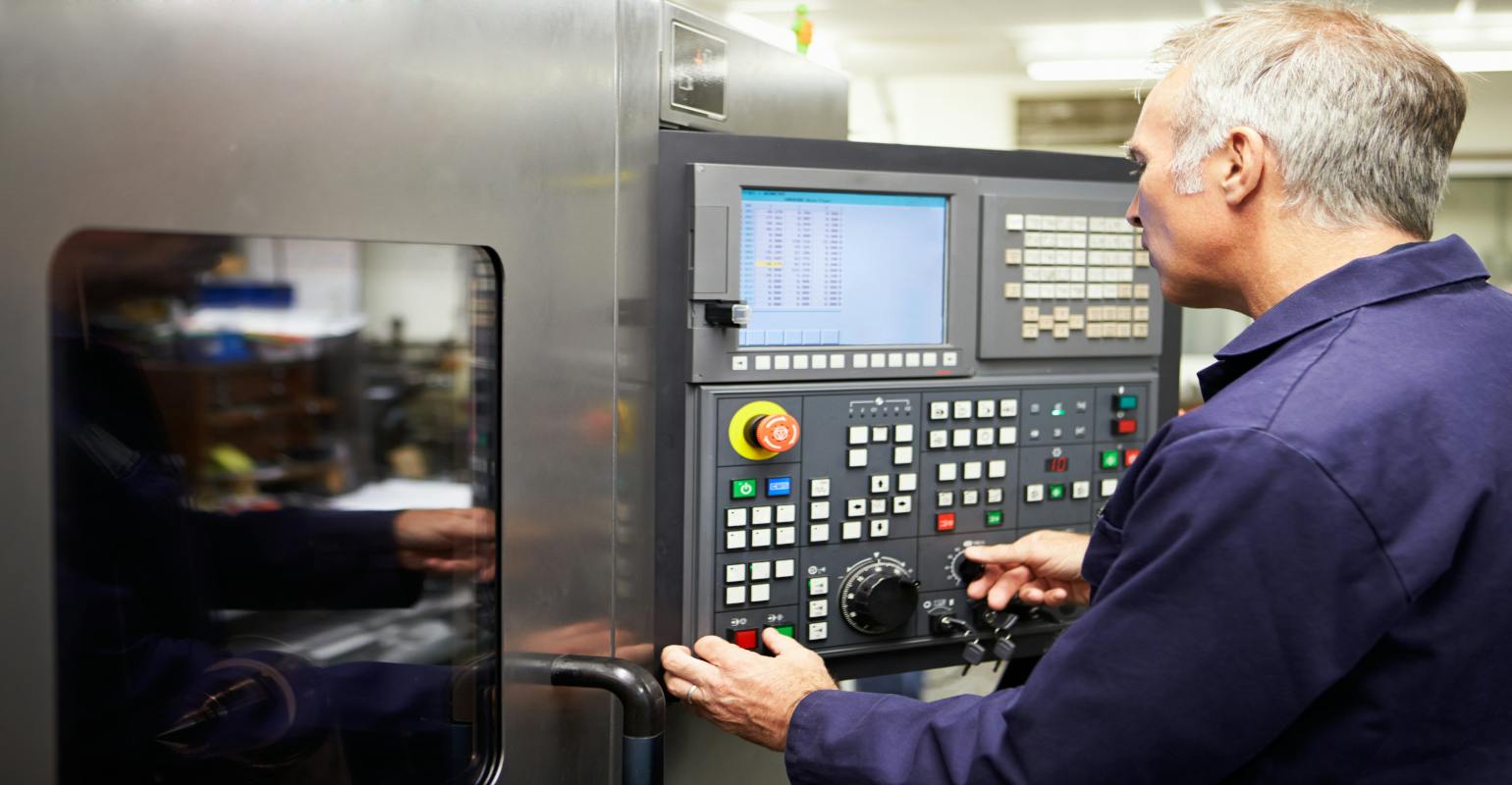 Operator and CNC lathe.