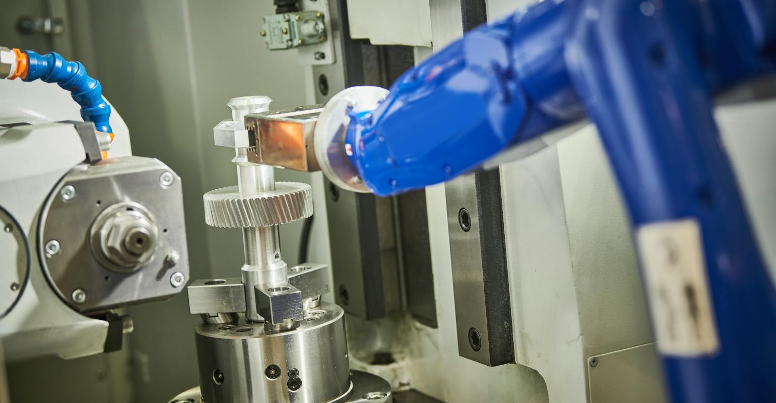 Robot load-unload system of CNC wheel gear cutting machine.